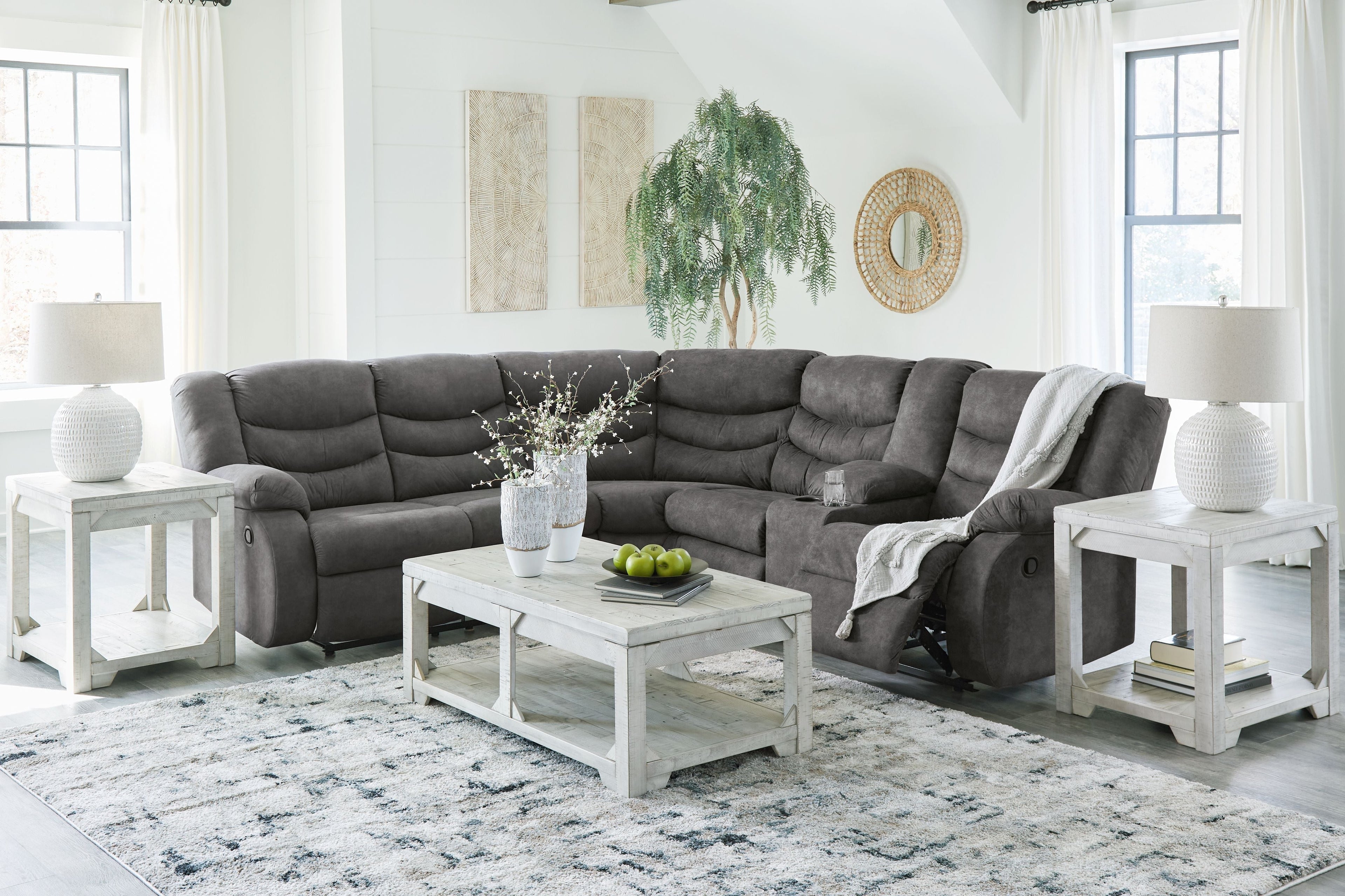 Slate gray reclining sectional sofa with chaise and tufted seat cushions