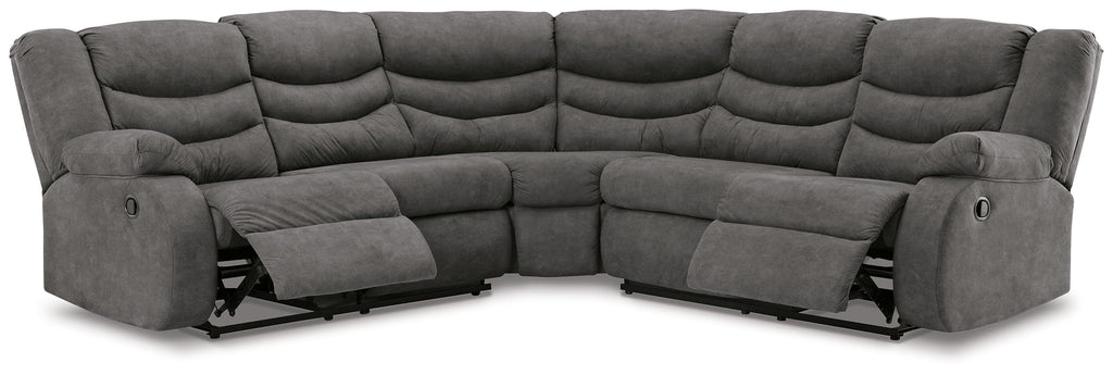 Slate gray reclining sectional sofa from front angle with tufted back and arms
