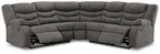 Slate gray reclining sectional sofa from front angle with tufted back and arms