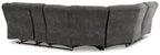 Slate gray reclining sectional sofa side view with three seat sections and metal recline bases