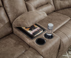 Dark taupe power reclining loveseat console with cup holder and inset tray area