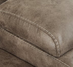 Close-up of dark taupe upholstery with stitched seam detail on the recliner arm
