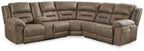 Power reclining sectional sofa in dark taupe fabric with tufted back and rounded arms