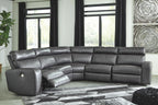 Gray power reclining sectional with diamond-textured back cushions and chaise ottoman