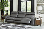 Gray power reclining loveseat with adjustable footrests and diamond back paneling