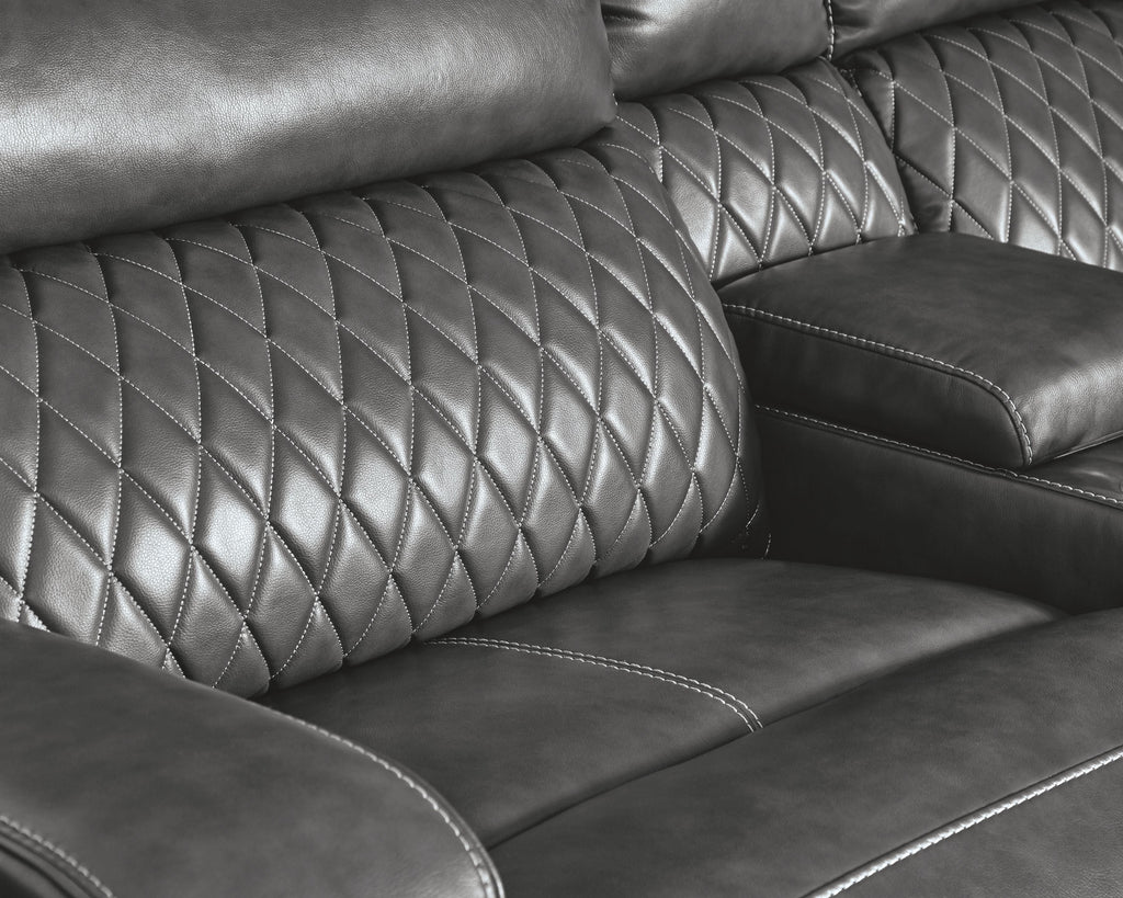 Gray power reclining sectional with diamond-quilted back and padded arm recline panel