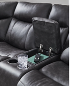 Reclining sofa chaise with console controls, cup holder, and dark padded armrest.
