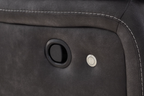 Dark carbon sofa control panel on the armrest with circular buttons and recessed handle.