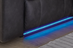Dark carbon sofa base with blue LED lighting strip and stitched seat back seams.