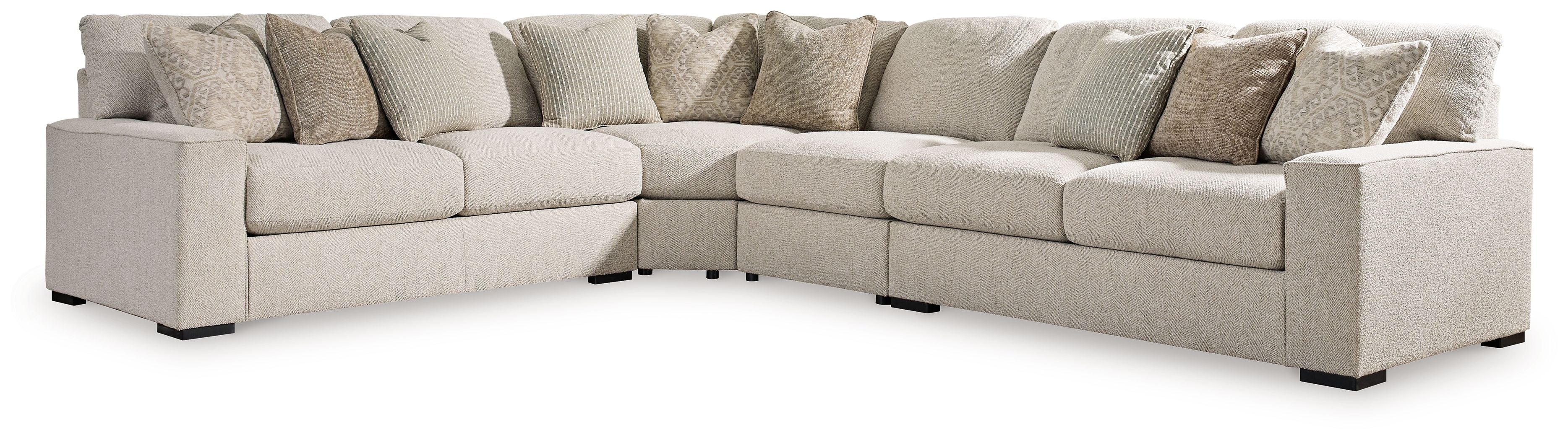 Sand beige L-shaped sectional sofa with square arms, black feet, and throw pillows