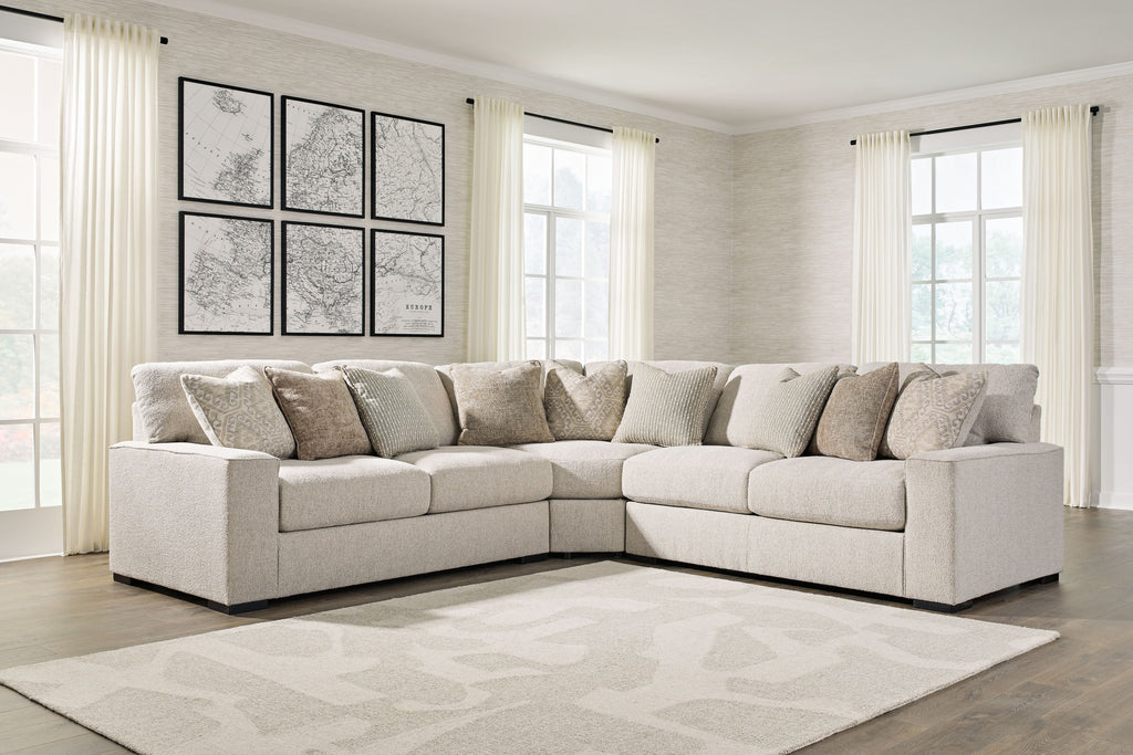 Sand beige sectional sofa with chaise corner and patterned throw pillows, black feet