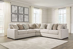 Sand beige sectional sofa with chaise corner and patterned throw pillows, black feet