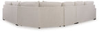 Sand beige sectional sofa corner with square arms, black feet, and layered back cushions