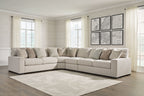 Sand beige sectional sofa with chaise corner and patterned pillows, black feet on base