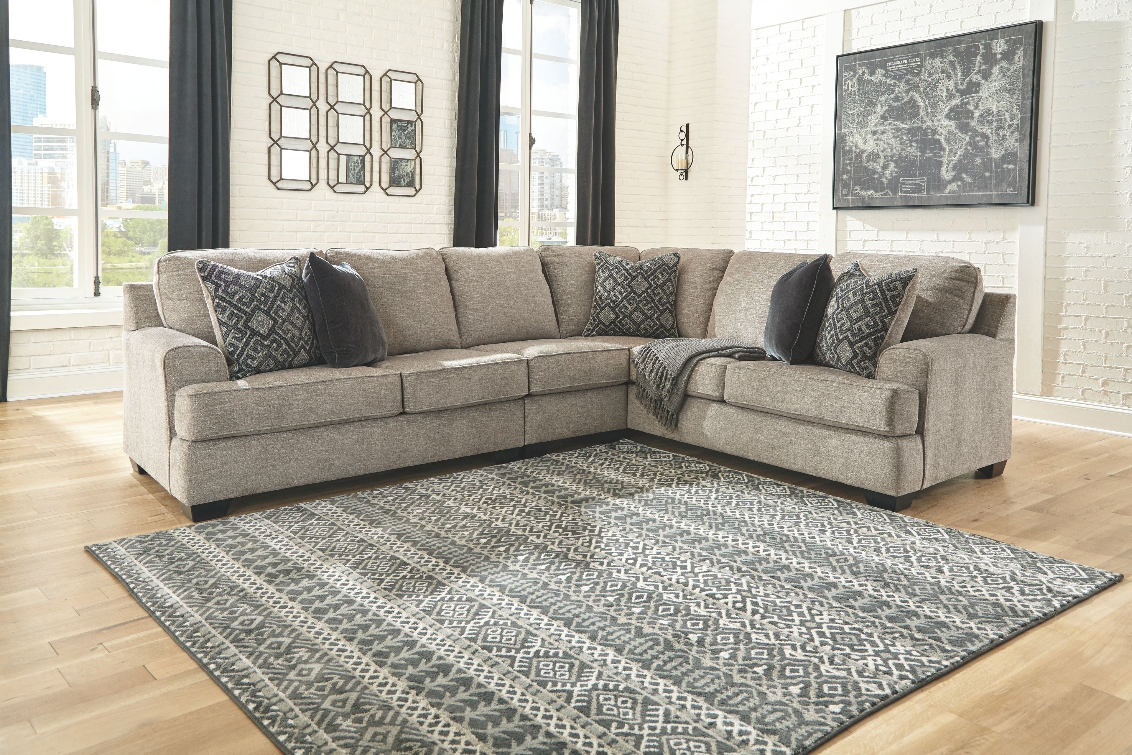 Stone sectional sofa with two chaise seats and patterned back cushions