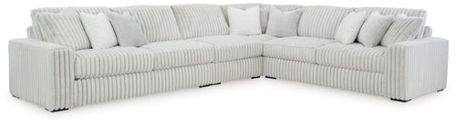 Light gray sectional sofa with corner chaise and striped ribbed fabric upholstery