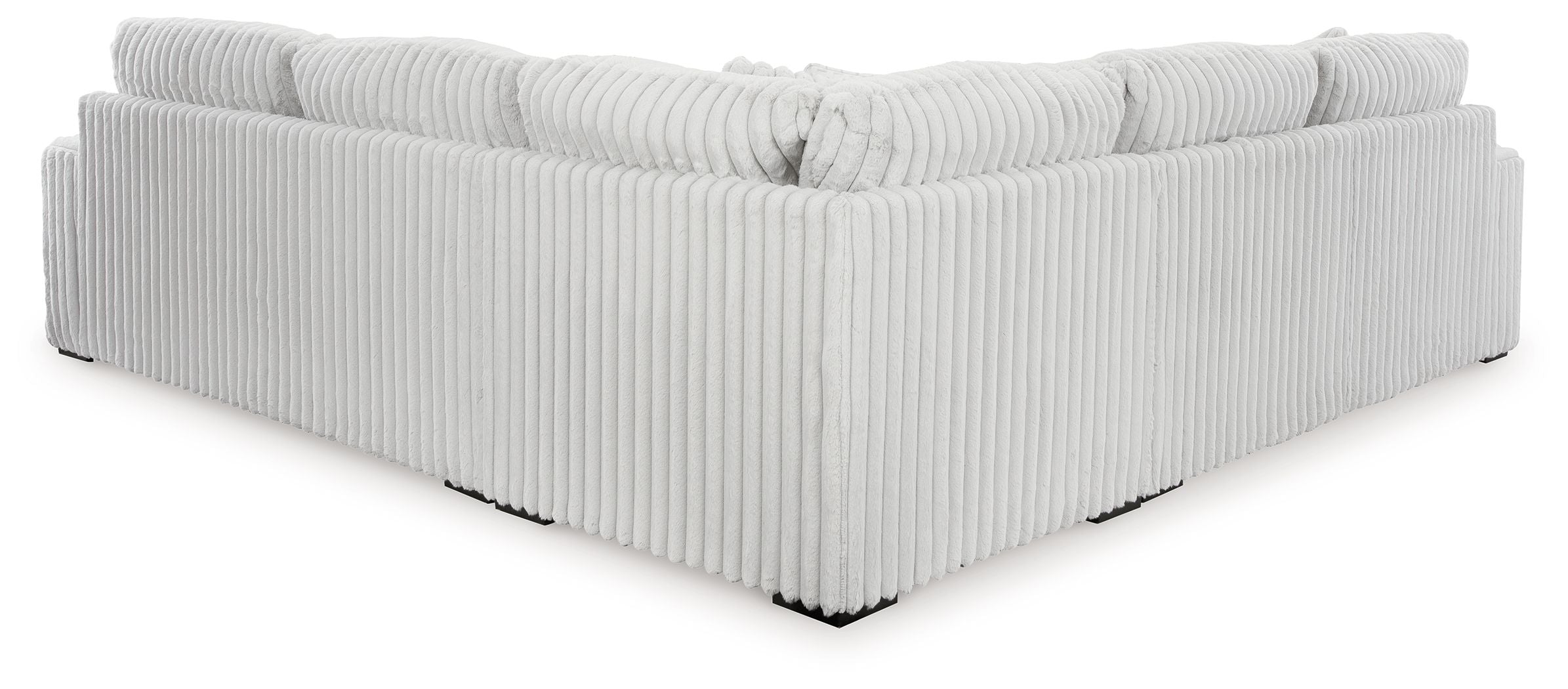Light gray sectional sofa corner with vertical ribbed sides and tight seat cushions