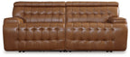 Chocolate brown reclining sectional sofa with tufted seat cushions and quilted back