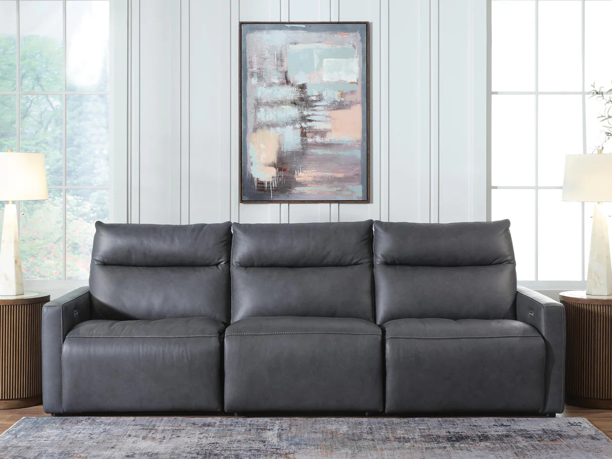 Dark gray power reclining sofa with three seat sections and padded back cushions