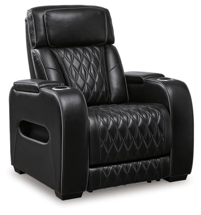 Black power recliner with adjustable headrest and diamond-quilted back and seat