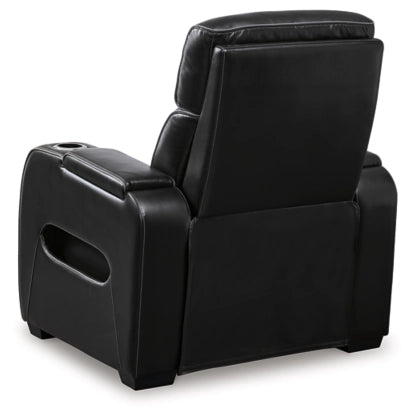 Black power recliner angled view with padded headrest and side storage panels