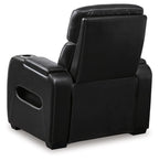 Black power recliner angled view with padded headrest and side storage panels