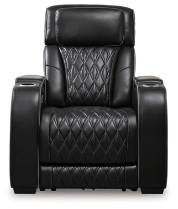 Black power recliner with tall headrest, diamond-quilted back and seat cushions