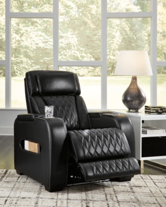 Black power recliner chair with adjustable headrest, diamond quilting on seat and back