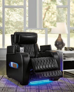Black power recliner with adjustable headrest and blue LED base lights