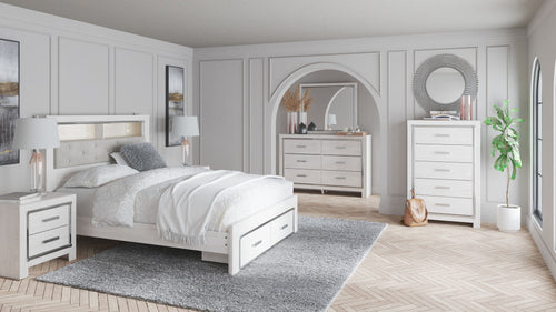 White bedroom set with bed, two nightstands, dresser, and mirror