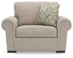 Chair and a half in heather light-gray fabric with patterned back pillow