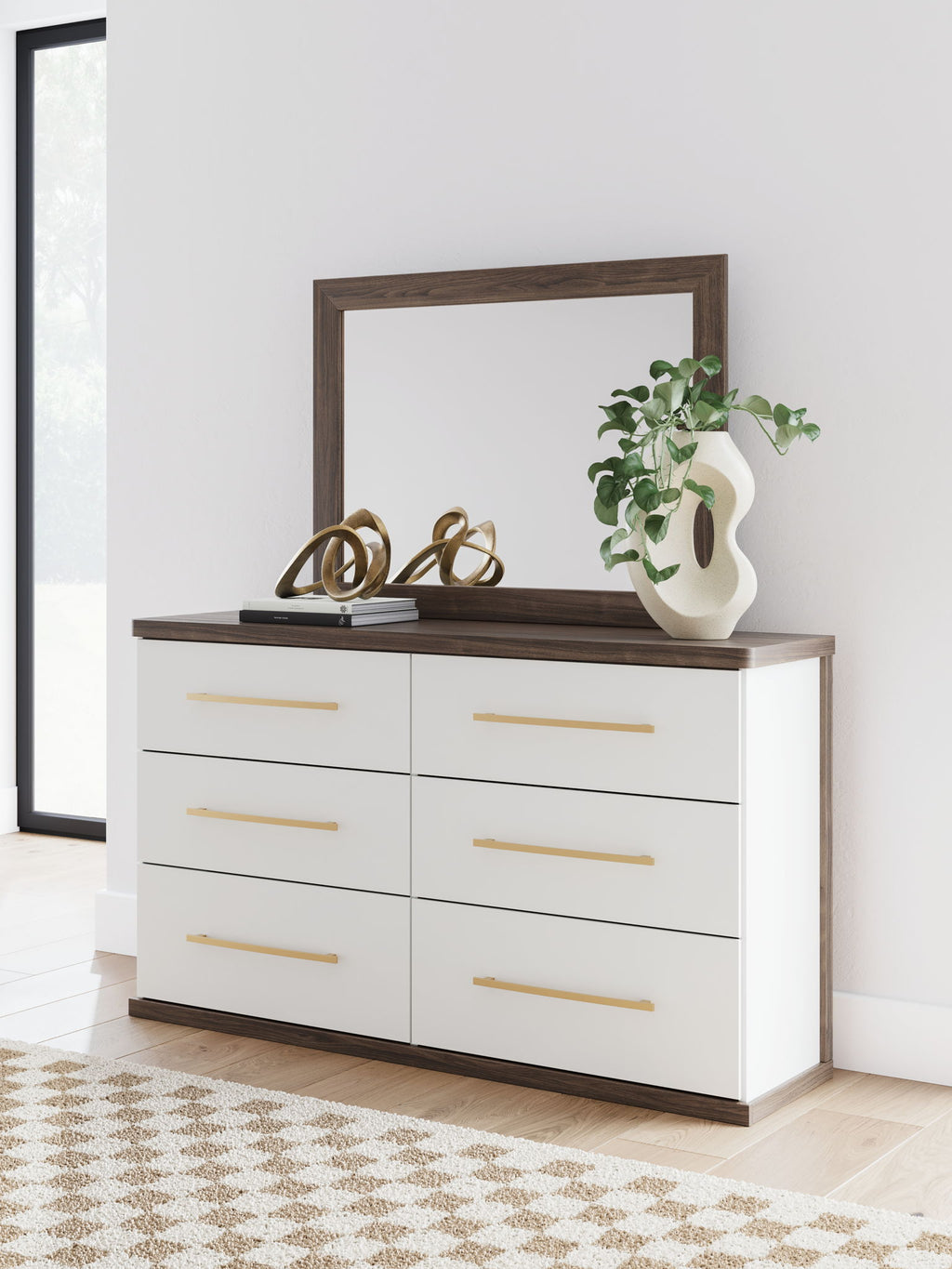 Six-drawer dresser with mirror and white drawers, warm wood top, gold bar pulls.