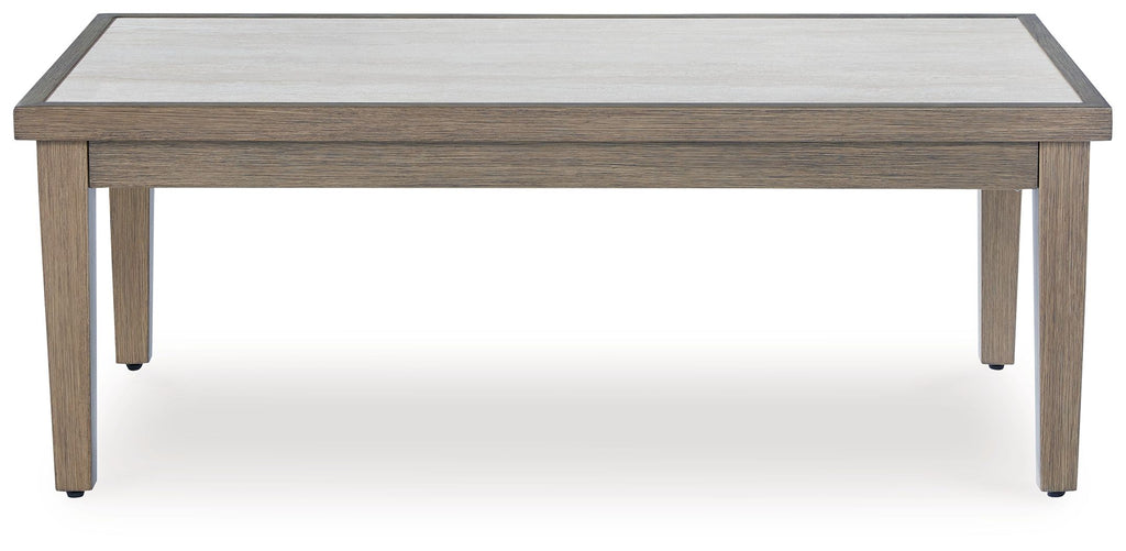 Rectangular cocktail table with pale tabletop and light wood frame, corner legs