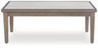 Rectangular cocktail table with pale tabletop and light wood frame, corner legs