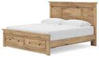 Light brown wooden storage bed with panel headboard, front drawers, and white mattress with pillows