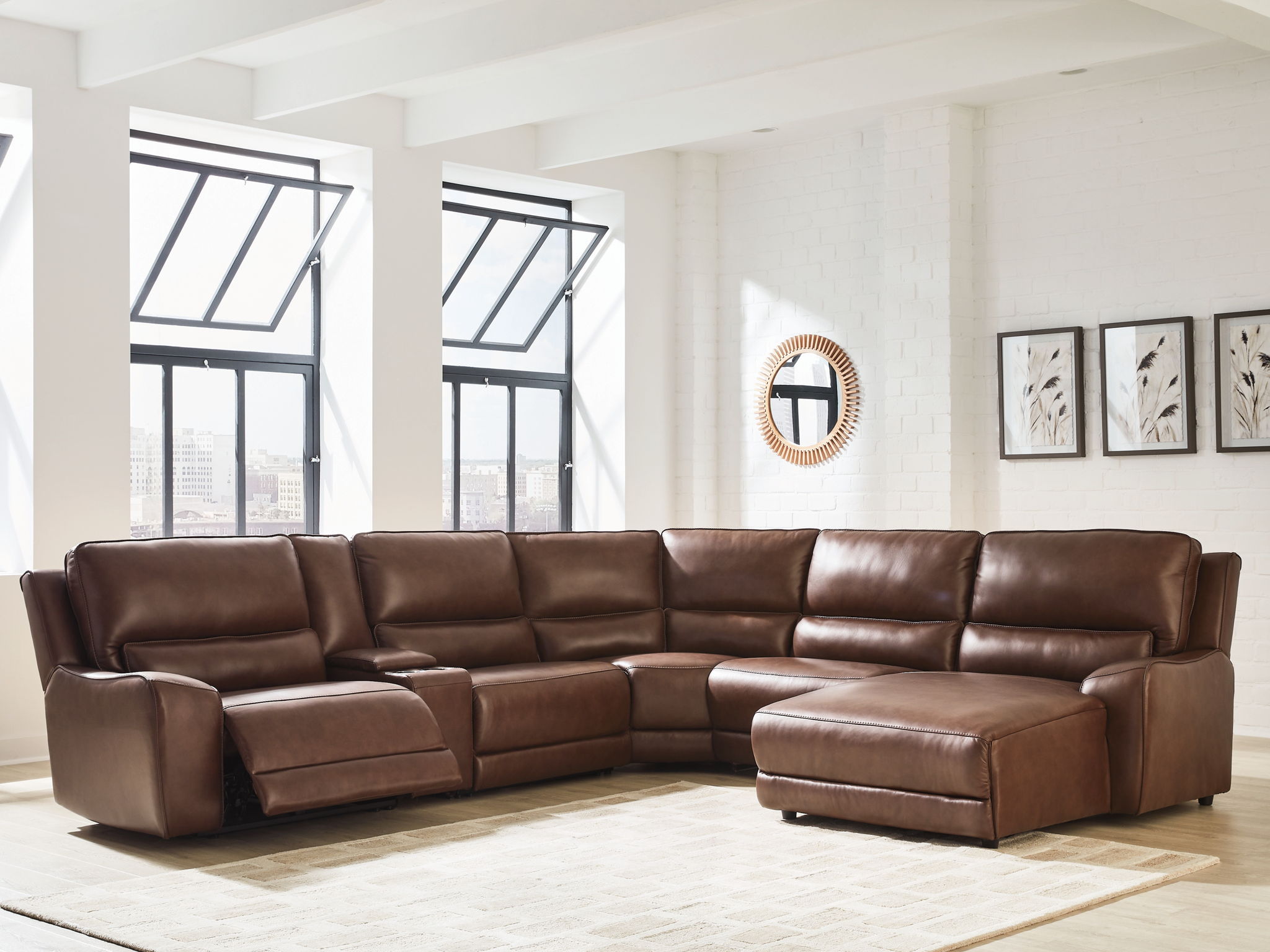 Brown power reclining sectional sofa with chaise and recliner footrest cushions