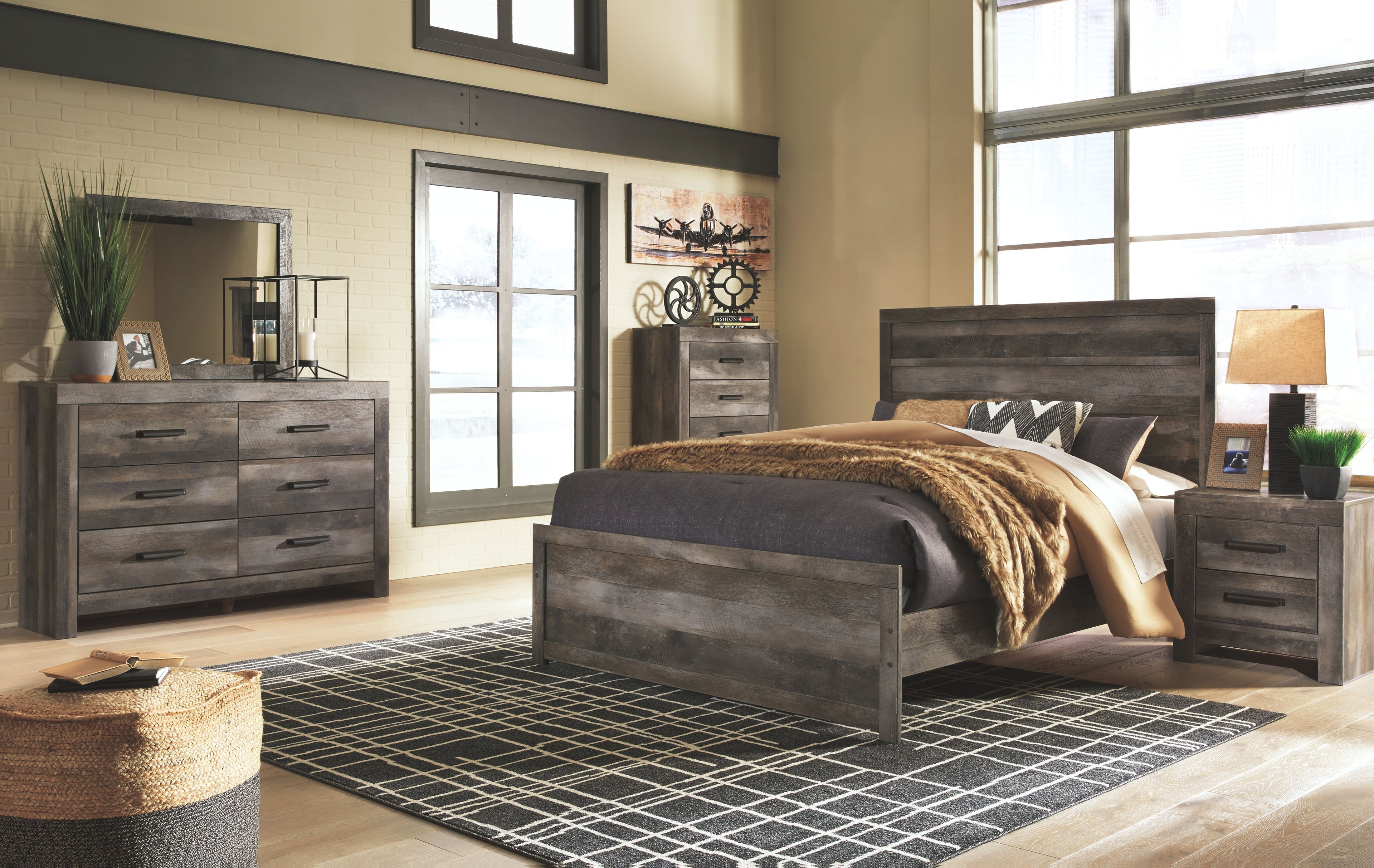 Gray dresser with mirror and drawers, bar pulls in a bedroom