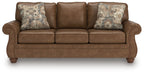 Chasemore sofa in dark brown with two patterned accent pillows