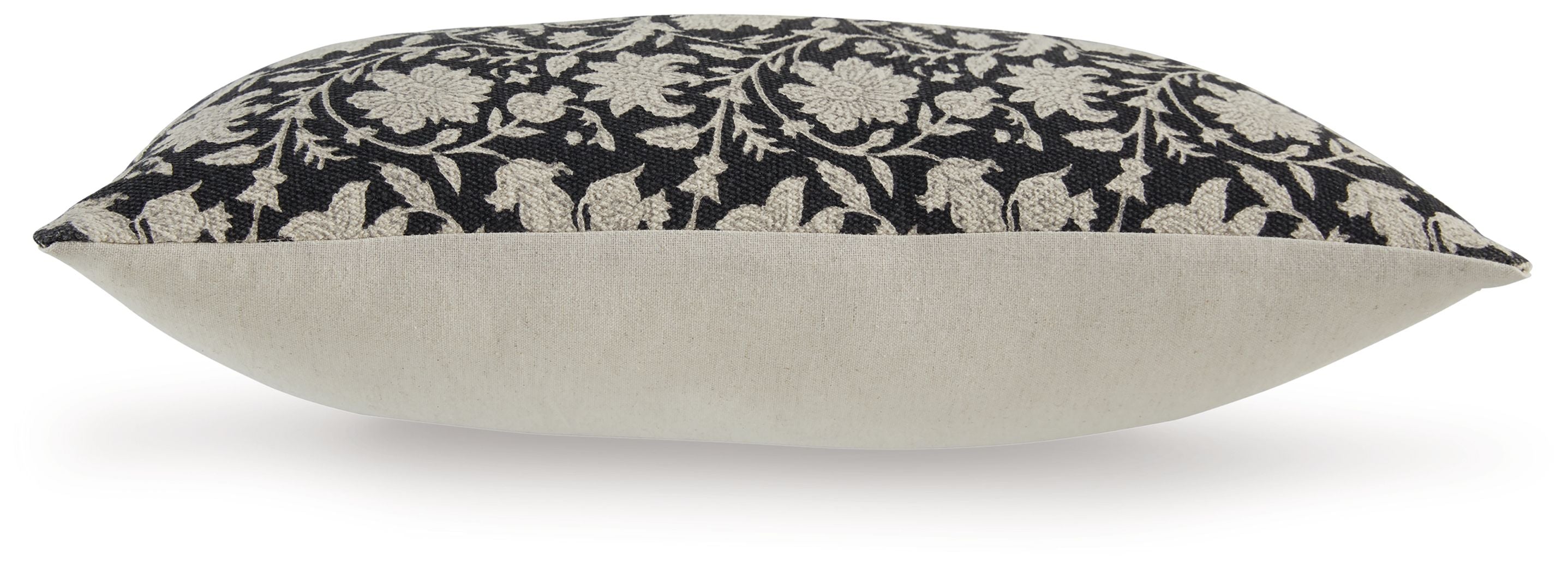 Black floral pillow with beige reverse and stitched border