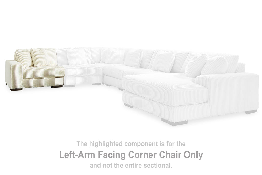 Ivory sectional corner chair with chaise and multiple seat cushions