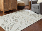 Deenbury rug laid in living room with off-white and beige swirl lines