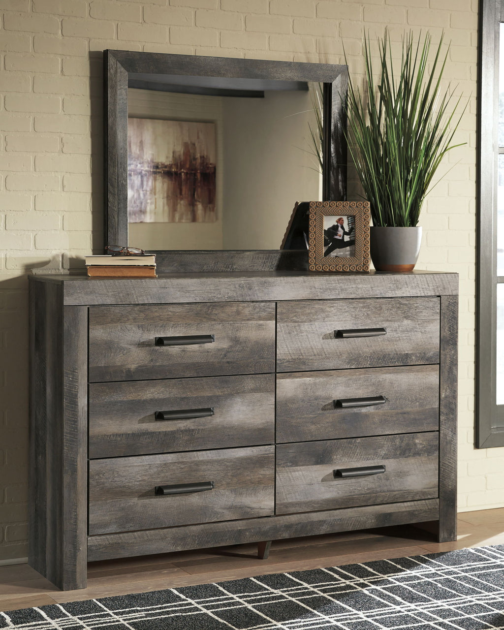 Gray wood dresser with four drawers and wall mirror with gray frame