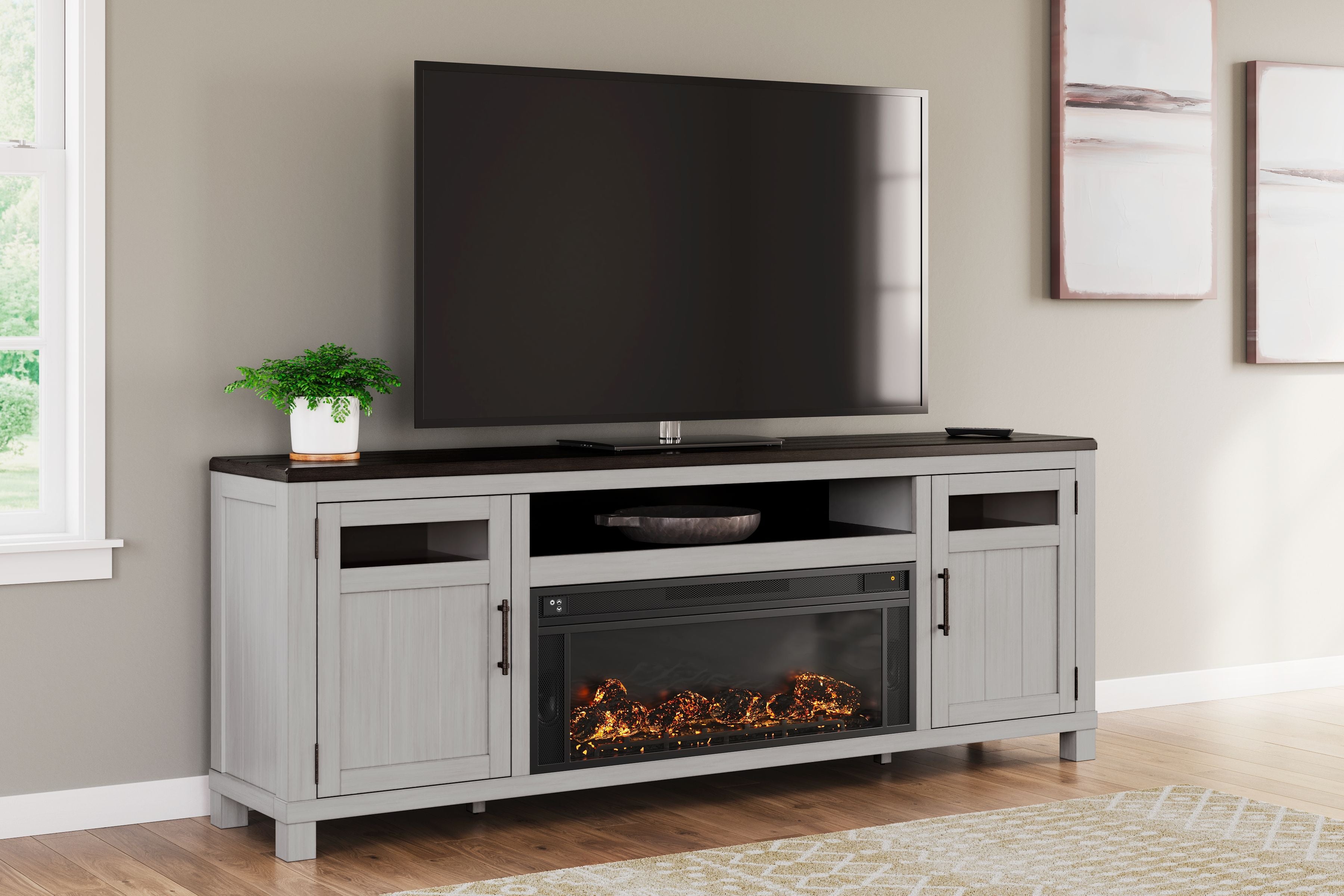 Gray TV stand with electric fireplace insert, open center shelf, and two side doors