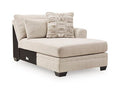 Light beige upholstered corner chaise with two cushions and patterned decorative pillow