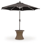 Round end table with umbrella: black canopy over beige woven base