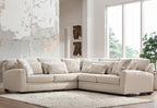 Light beige sectional sofa with chaise and square arms, with four sofa pillows