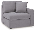 Heather gray upholstered corner chair with squared arms and padded seat