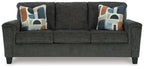 Dark gray sofa with three seat cushions and patterned throw pillows