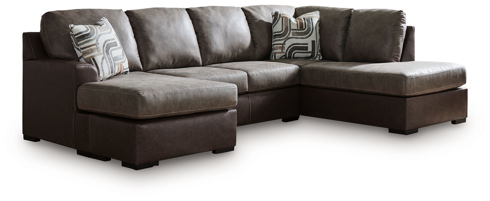 Dark fossil sectional sofa with wide chaise and two gray patterned accent pillows