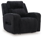 Black corduroy recliner with adjustable headrest and padded armrests